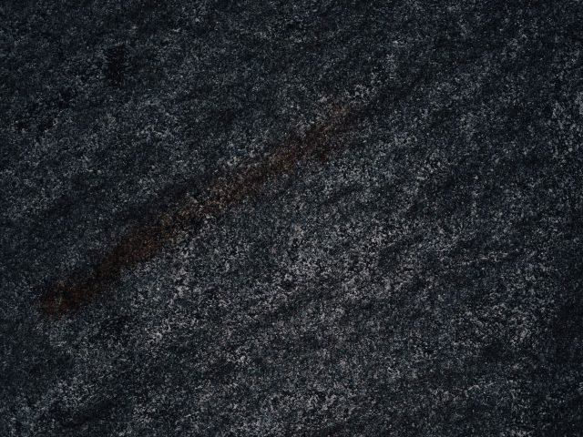 Black Galaxy granite slab, speckled dark stone