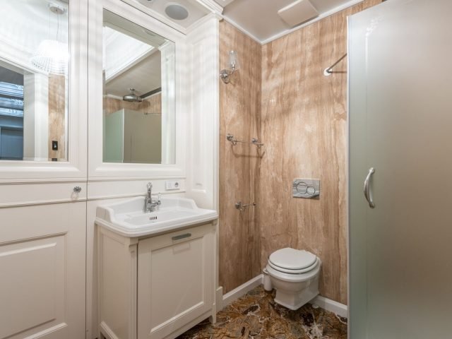 Renovated bathroom with marble accents